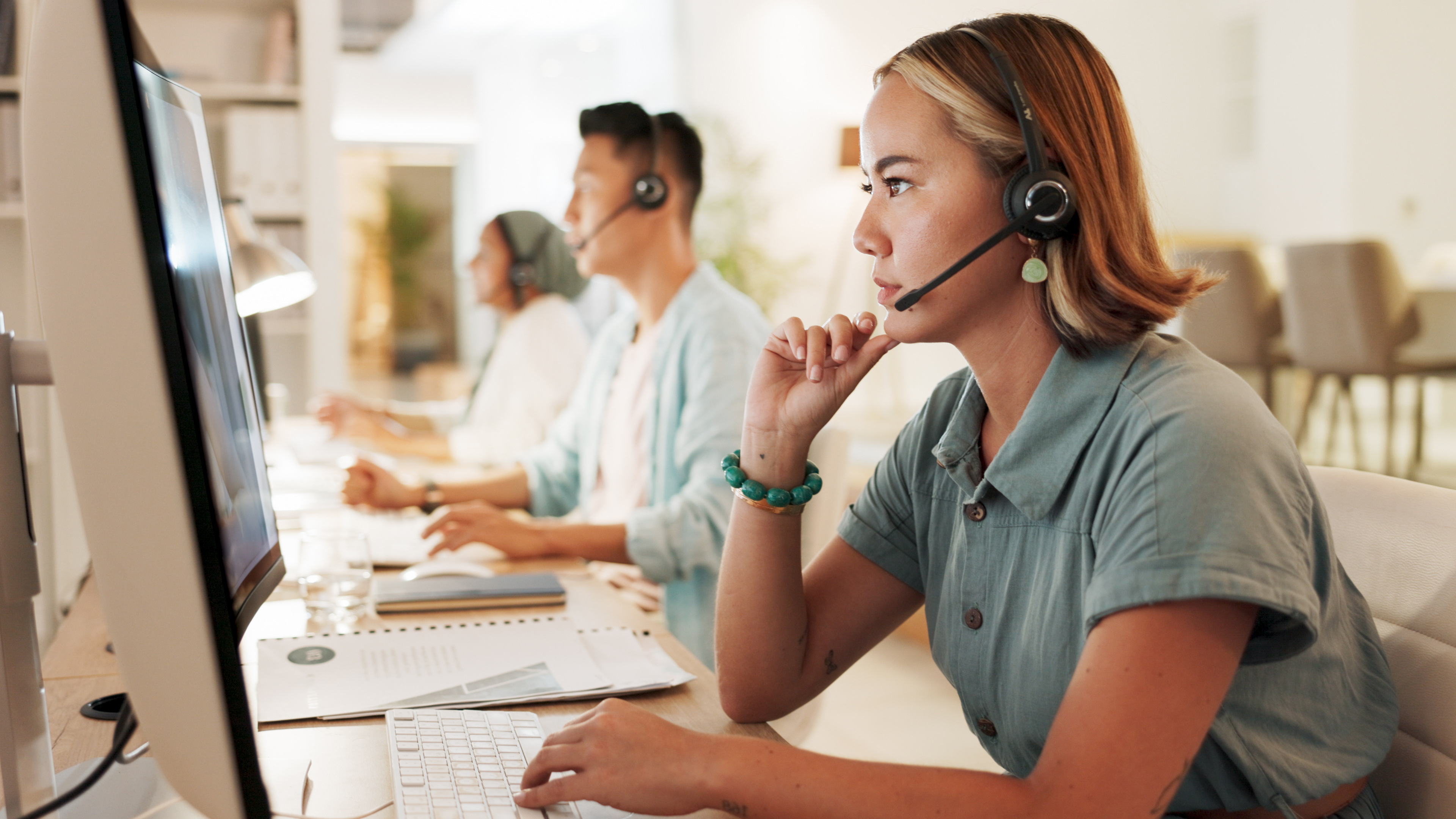 Call center, agent and thinking with woman in office for contact us, communication and customer service. Saleswoman, help desk and technical support with person in consulting agency for telemarketing.